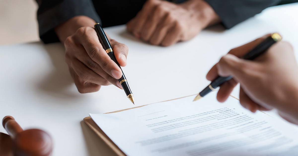 Lawyer and client sign variou financial legal contract to mediate with the legal execution